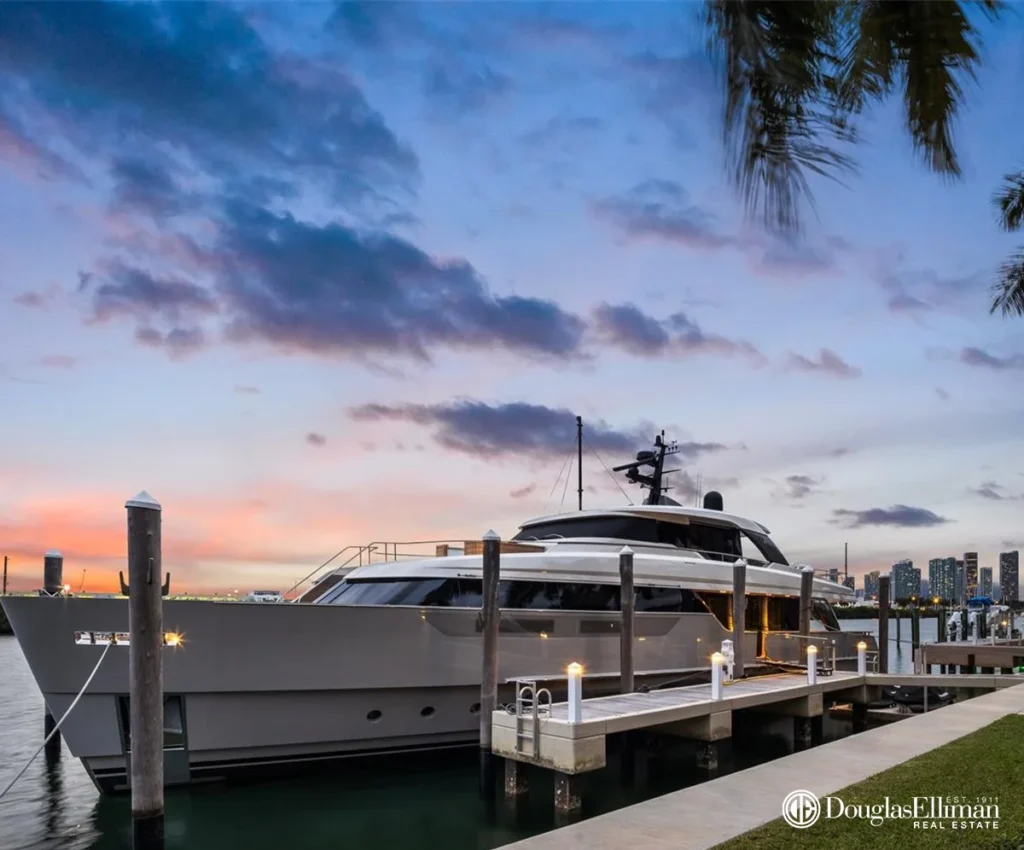 Detailed image of Miami Luxury Waterfront Property Private Yacht Docking Sunset Skyline View, a premier Waterfront Estate showcasing water views in the exclusive Palm Island neighborhood.