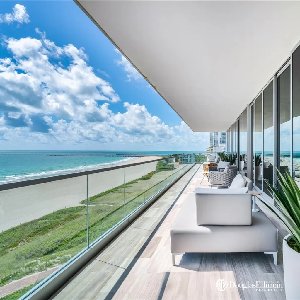 A secluded private terrace at the 321 Ocean luxury condo in South of Fifth, showcasing elegant outdoor furnishings and breathtaking, panoramic ocean views from a Miami Beach residence.
