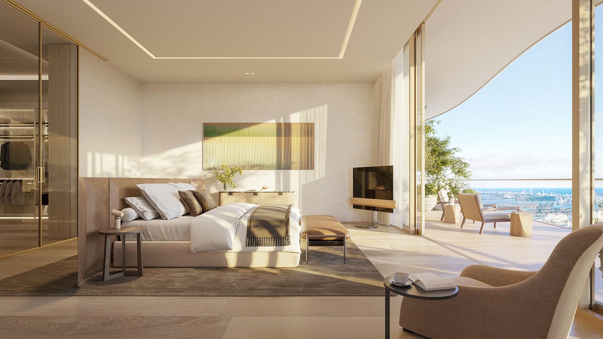 1428 Brickell penthouse primary bedroom featuring floor-to-ceiling windows with panoramic Biscayne Bay views