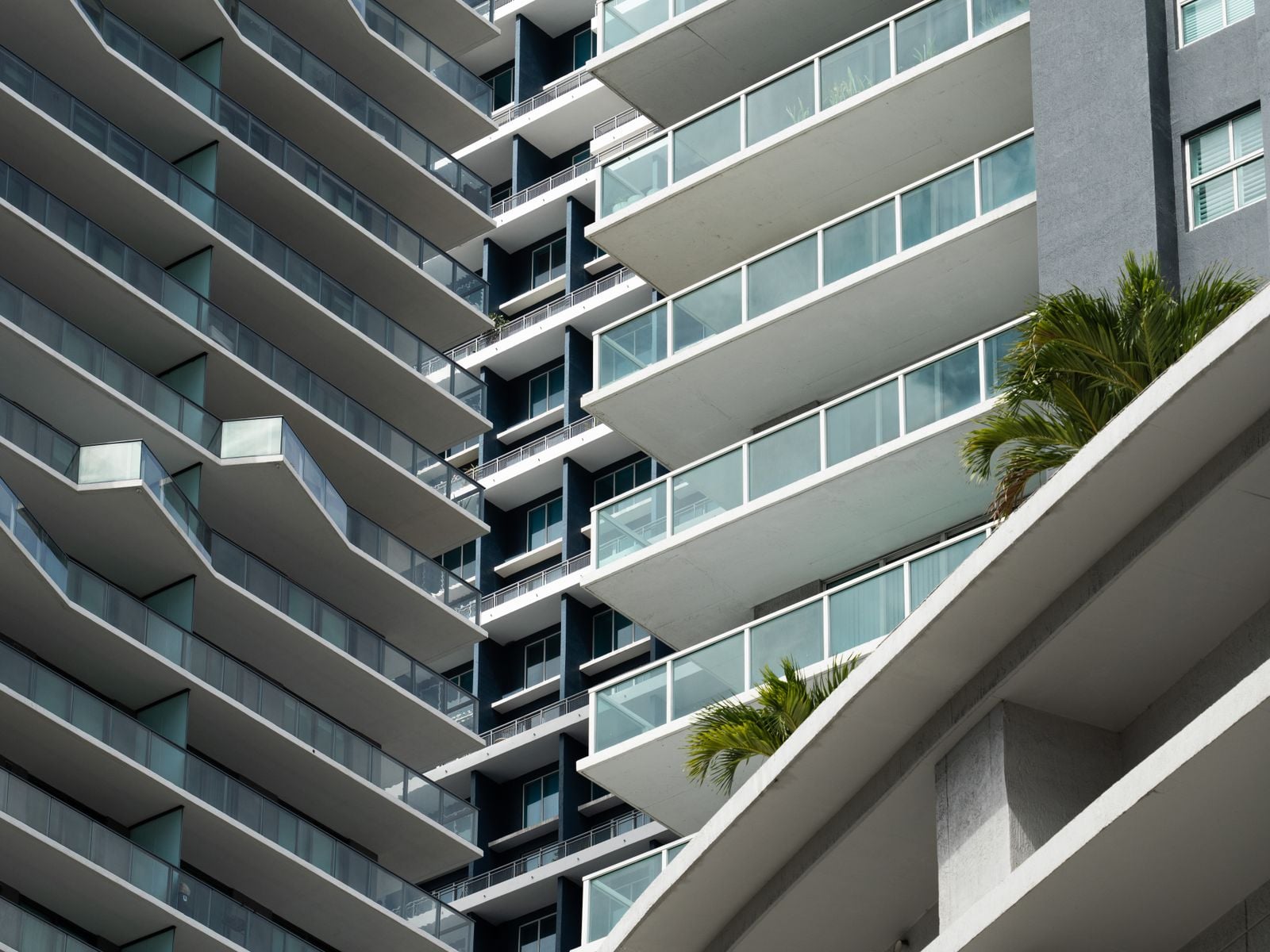 Close-up of a modern Miami condo facade highlighting construction quality concerns in 2026