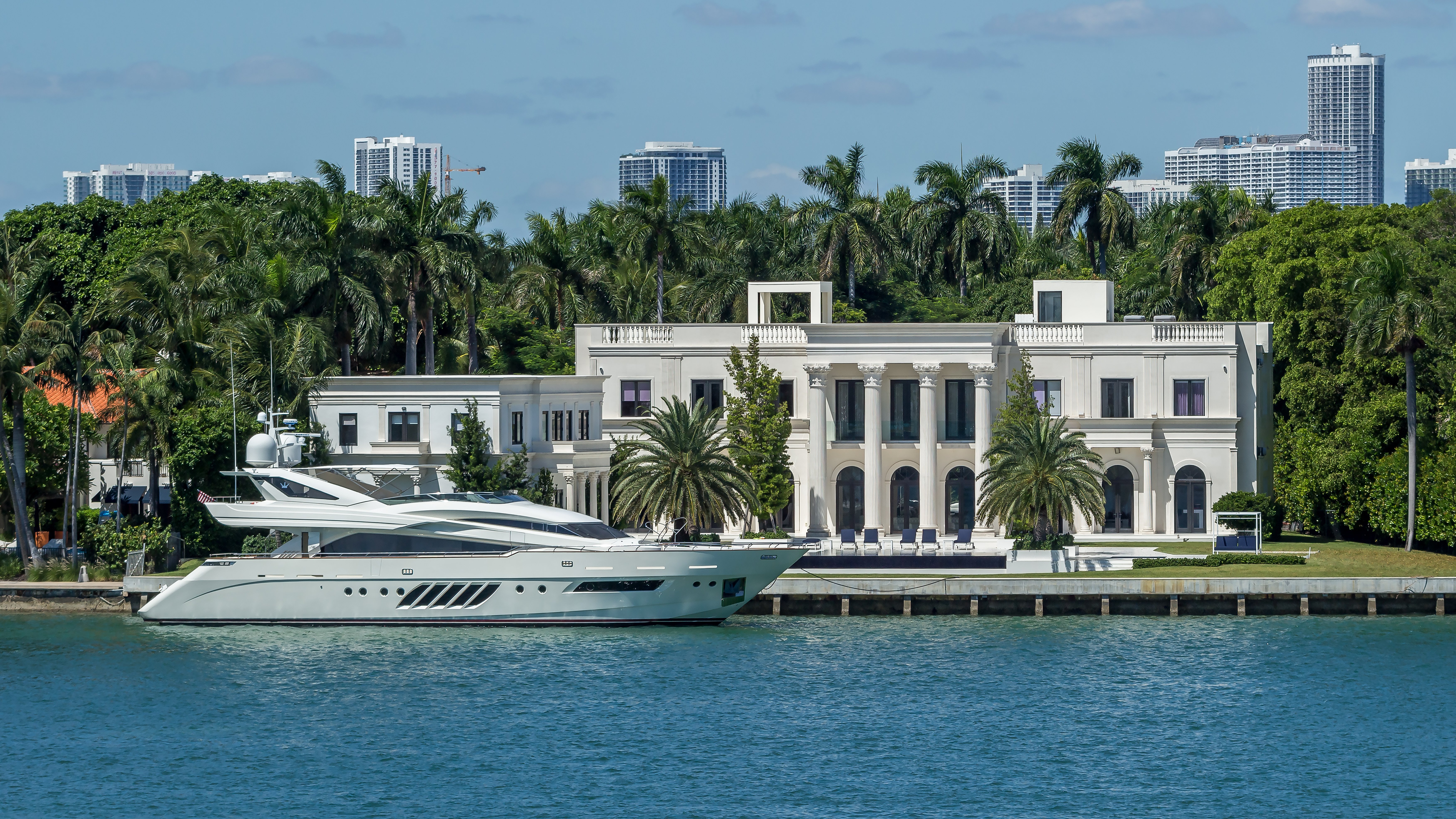 Luxury waterfront mansion on Star Island in Miami Beach with palm trees and waterfront views