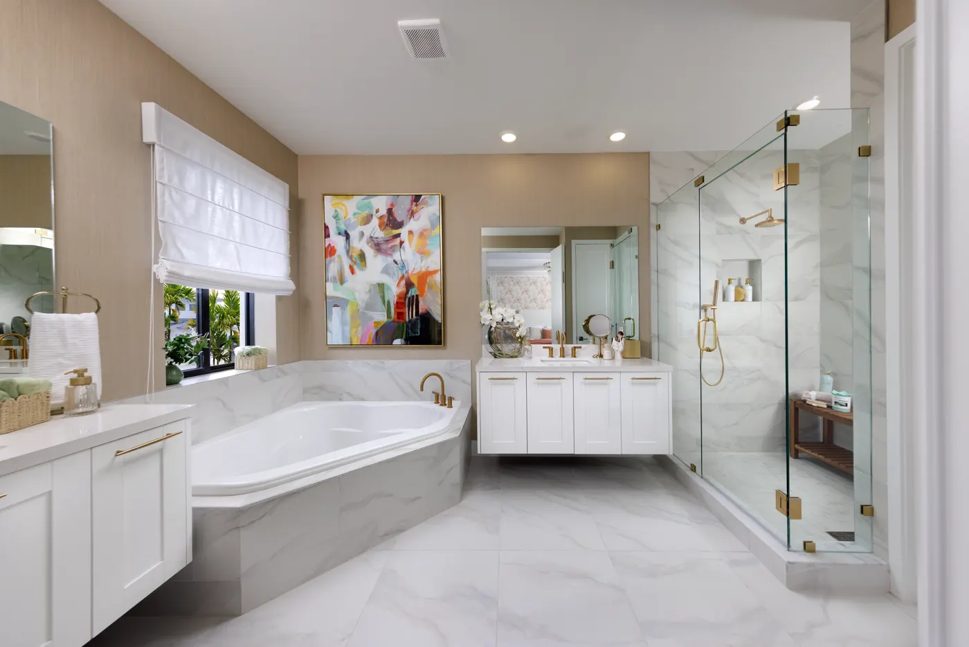 Owner's bath with soaking tub and frameless glass shower in the Piedra model at Greenview at Presidential