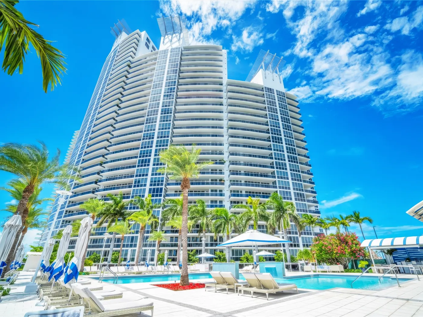 Murano Grande towers seen from the pool deck under a blue sky