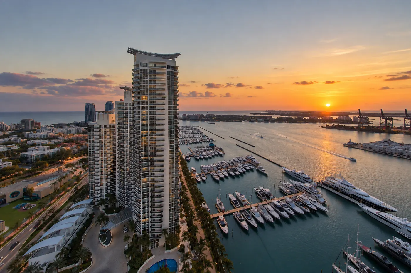 Murano Grande towers at sunset above the yachts of the Miami Beach Marina and Biscayne Bay