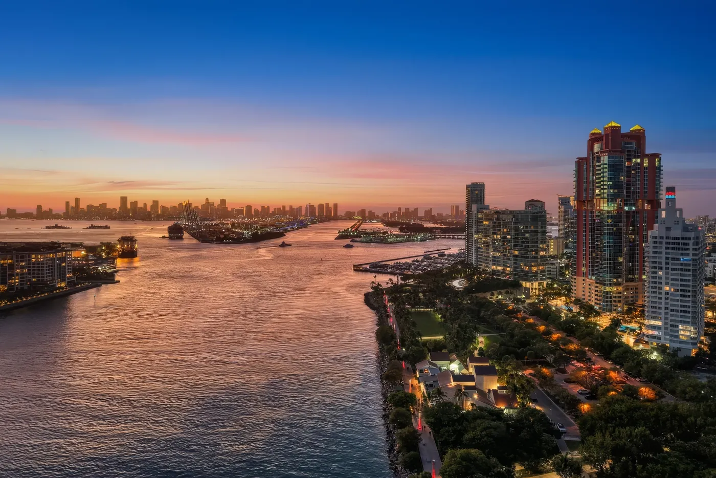 Sunset over Government Cut and the downtown Miami skyline, with Portofino Tower and the South Pointe towers on the right